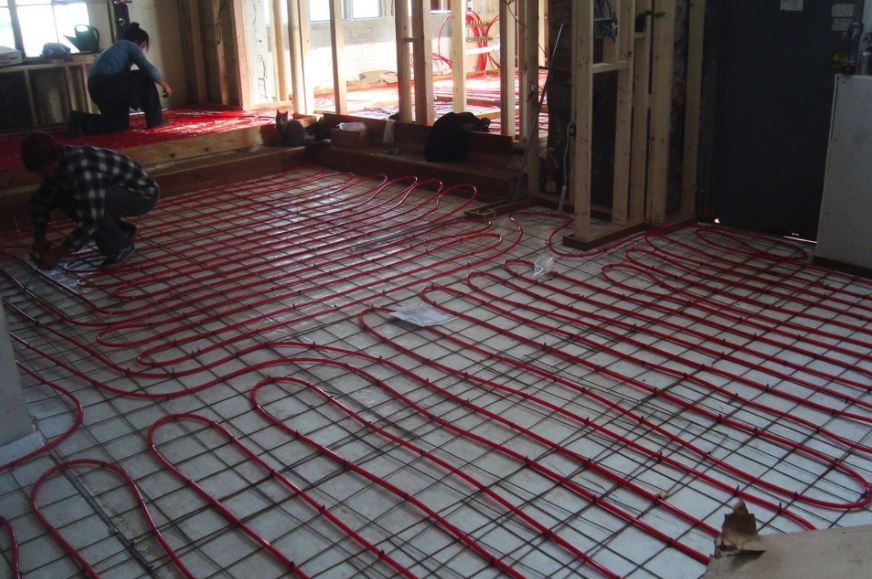 Heated flooring pipes being laid out
