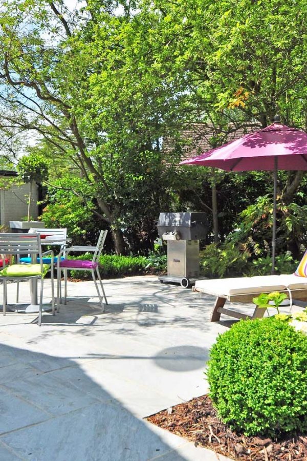 Outdoor furniture on sunny garden patio