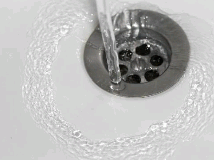 Flushing The Drain With Hot Water