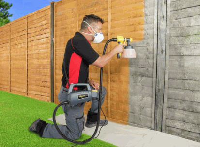 The man applying Sprayable fence Paint