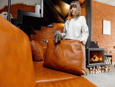 Vacuuming the leather couch